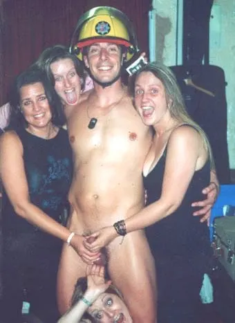 Group of housewives with fireman male stripper.