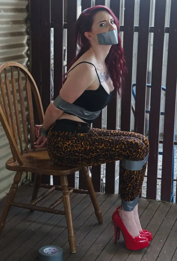 Redhead captive and helpless 