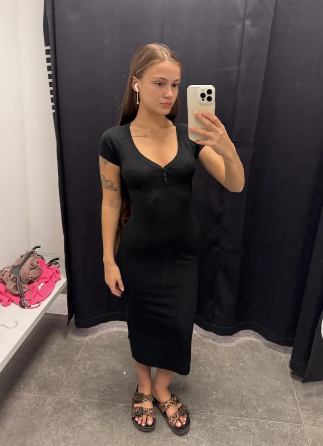 This black dress hides a very sexy figure