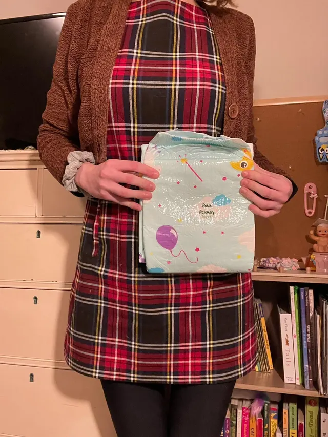 Big sis says it's time to diaper up!