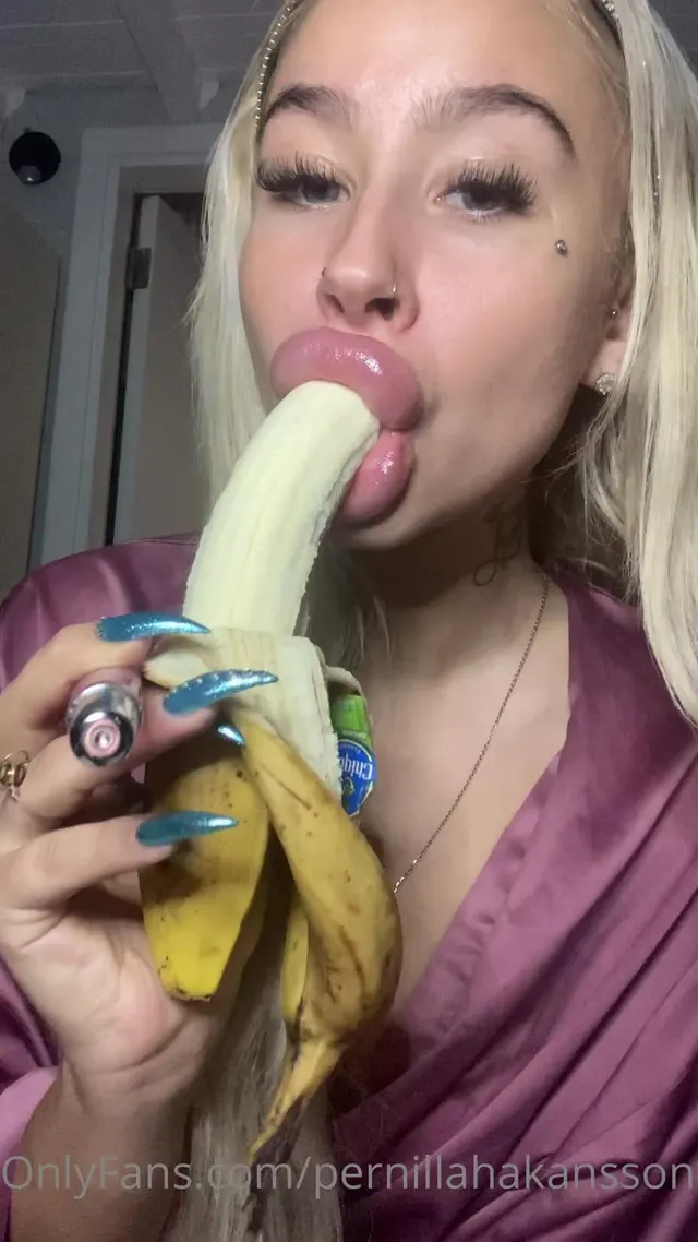 Sucking on a banana