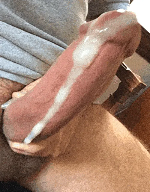 Cum oozing down his cock