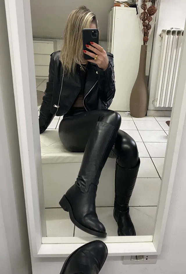 Sexy girl in leather and boots