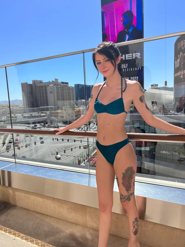 Tattooed little slut on the rooftop pool deck
