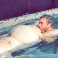 I invited this cute 20-year-old Grindr boy over to join me in my backyard hot tub. When he arrived I was already naked. He couldn't resist my fat old man cock and immediately got to work. Good boy!