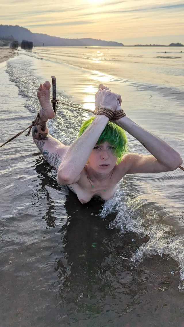 Hogtied in the frigid river 