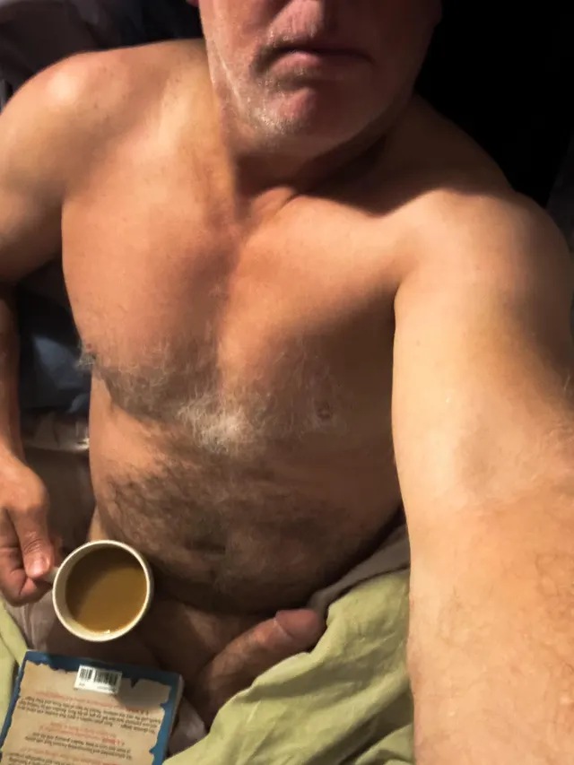 A book, a coffee and a bed