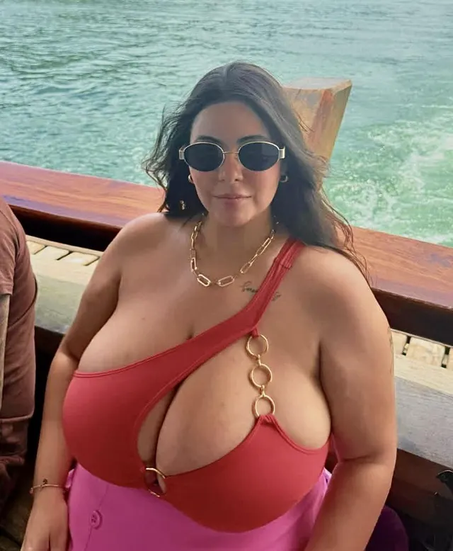 In her lap on a boat