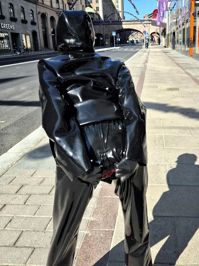 Layers of latex, including my catsuit with integrated vaginal and anal condoms!