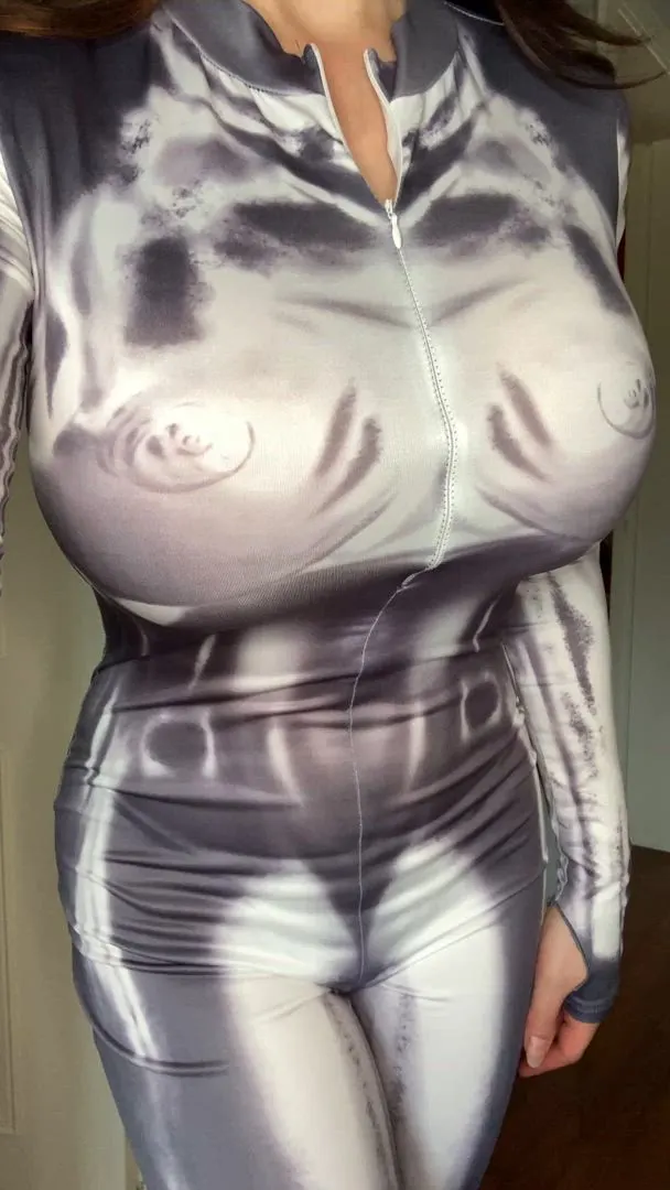 Bimbo revealing her massive fake boobs out of a tight bodysuit