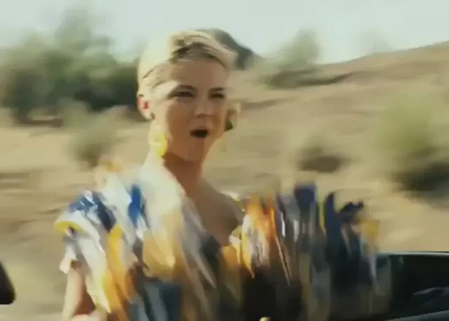 Blonde cheerleader flashing her boobies!