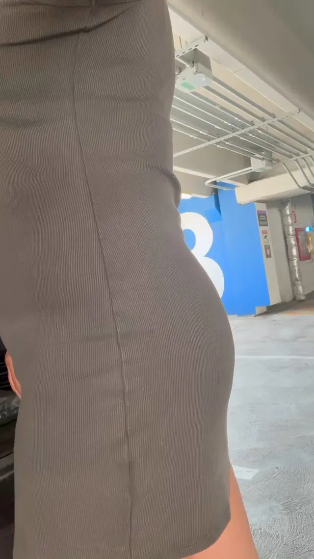 A naughty mom with a pantiless pussy and full ass in the parking garage.