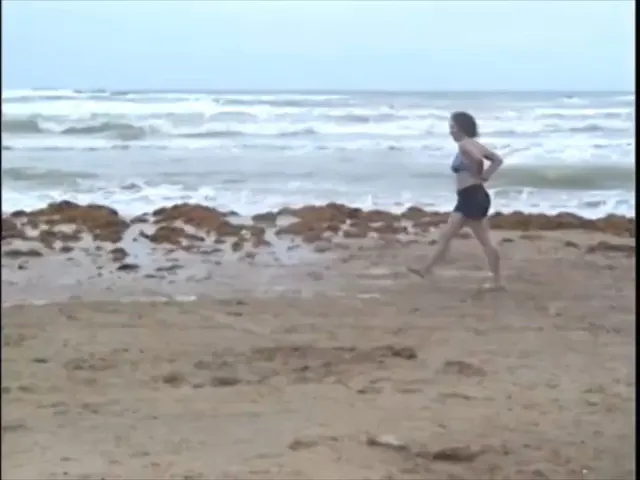 Topless wrestling on the beach 